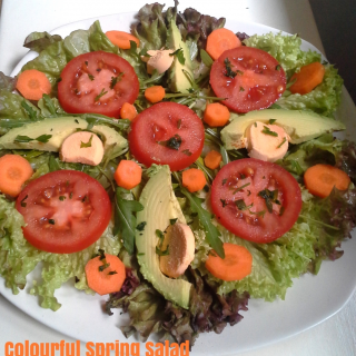Colourful Spring Salad with avocado carrots and tomato